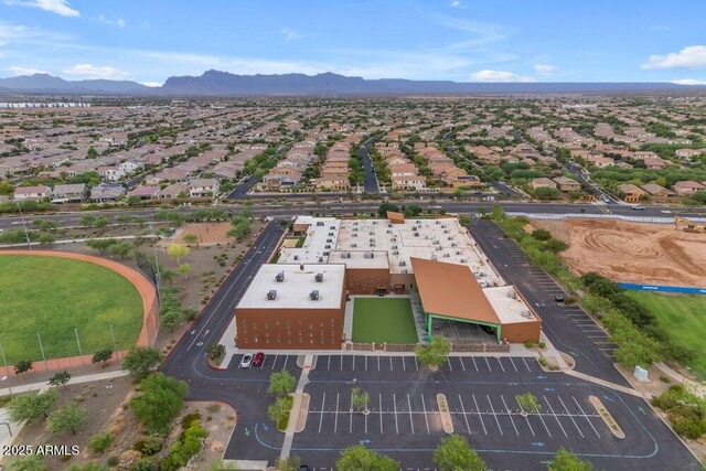 birds eye view of property with a mountain view
