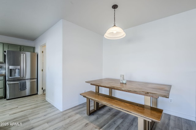 dining room with light hardwood / wood-style flooring