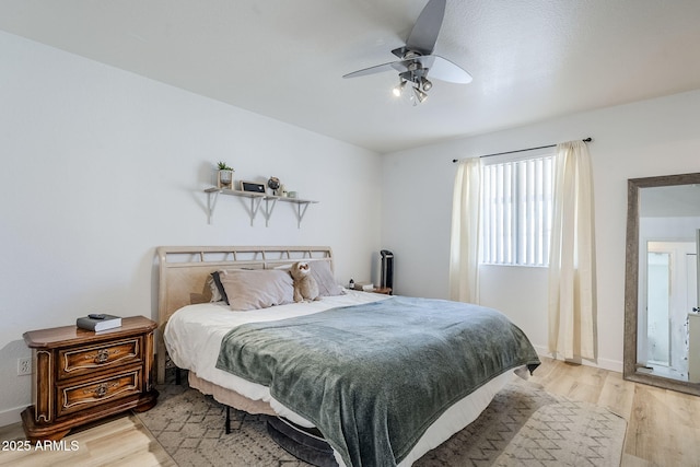 bedroom featuring ceiling fan and light hardwood / wood-style floors