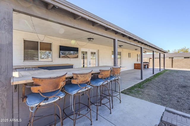 view of patio / terrace with an outdoor bar