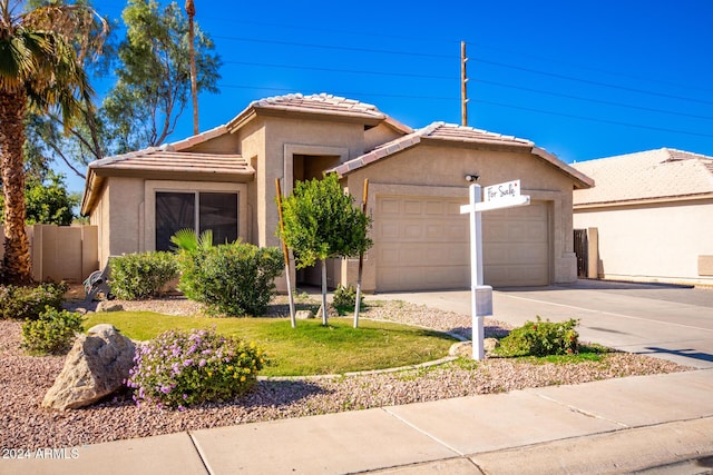 ranch-style house featuring a garage