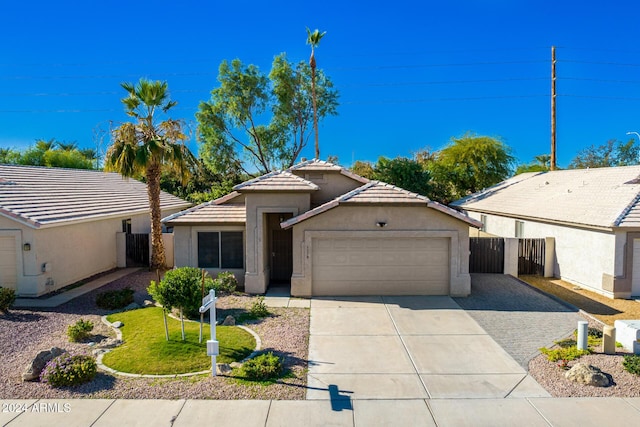 ranch-style house featuring a garage