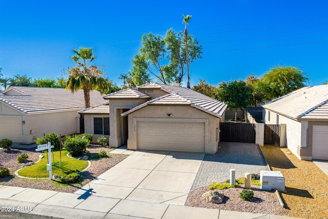 ranch-style house featuring a garage