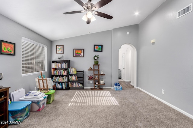 game room with carpet flooring, ceiling fan, and vaulted ceiling