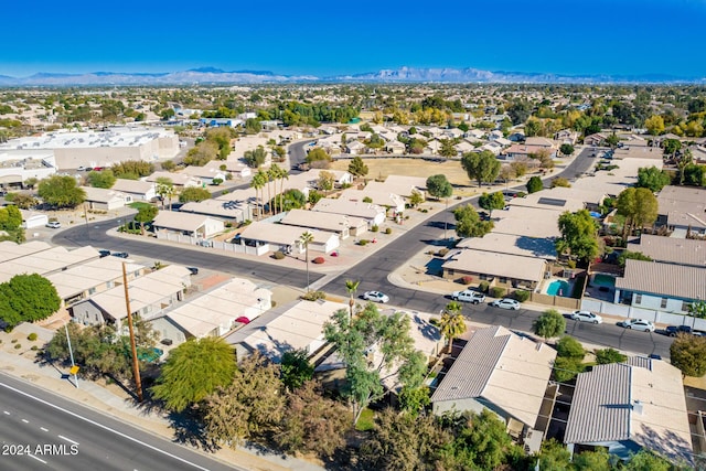 birds eye view of property featuring a mountain view