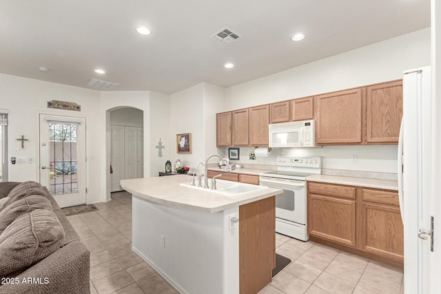 42328 N 46th Ln, Phoenix, AZ 85086 - kitchen with open floor plan, white appliances, a sink, arched walkways, and visible vents
