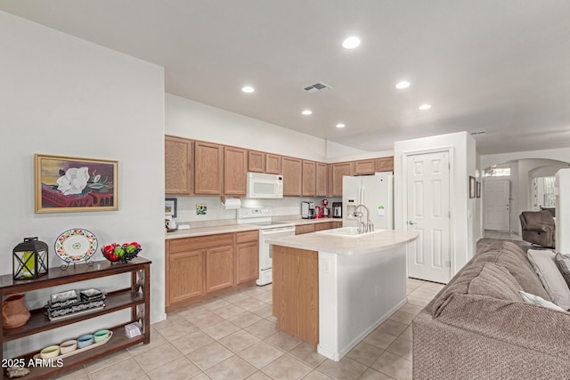 42328 N 46th Ln, Phoenix, AZ 85086 - kitchen featuring light countertops, open floor plan, white appliances, visible vents, and arched walkways