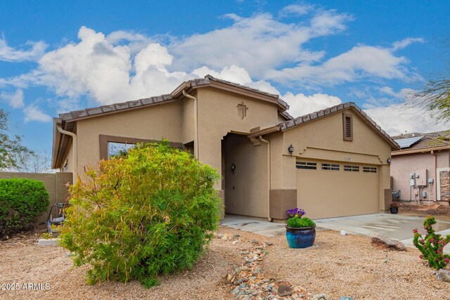 42328 N 46th Ln, Phoenix, AZ 85086 - mediterranean / spanish-style home featuring stucco siding, an attached garage, and concrete driveway