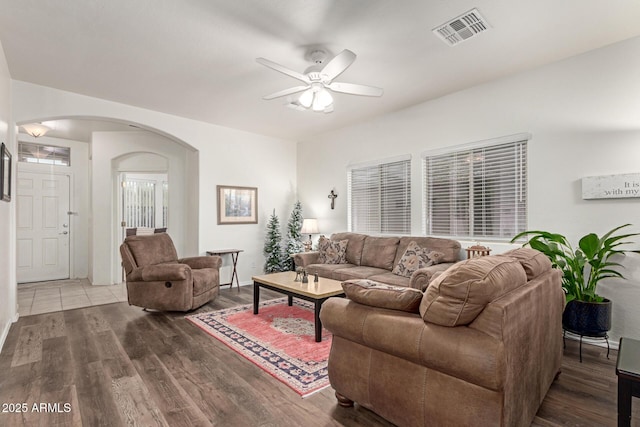 42328 N 46th Ln, Phoenix, AZ 85086 - living room with arched walkways, ceiling fan, visible vents, and wood finished floors