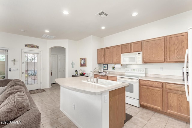 42328 N 46th Ln, Phoenix, AZ 85086 - kitchen with a sink, open floor plan, white appliances, visible vents, and arched walkways