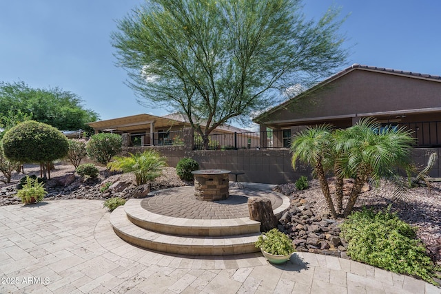 22574 W Moonlight Path, Buckeye, AZ 85326 - view of patio featuring a fire pit