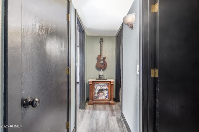 corridor featuring wood finished floors