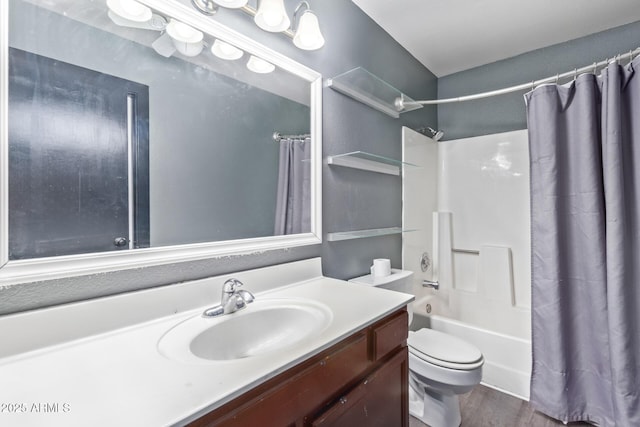 bathroom with toilet, wood finished floors, vanity, and shower / bathtub combination with curtain