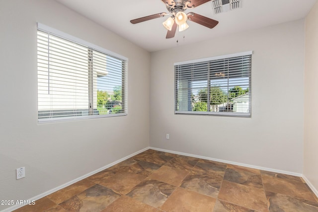 unfurnished room with ceiling fan