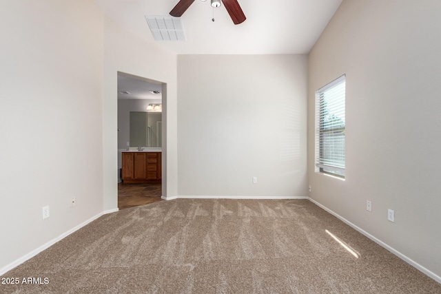 unfurnished room featuring carpet and ceiling fan