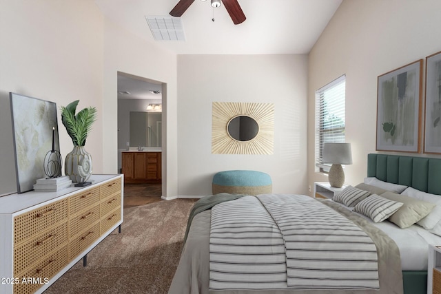 bedroom featuring ensuite bath, ceiling fan, and dark carpet