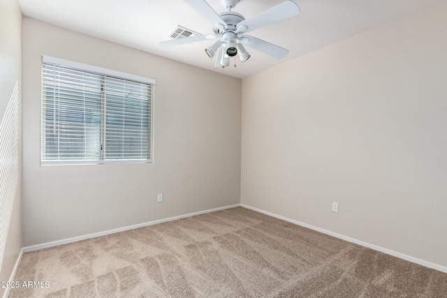 empty room with light colored carpet and ceiling fan