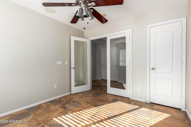 unfurnished bedroom with french doors and ceiling fan