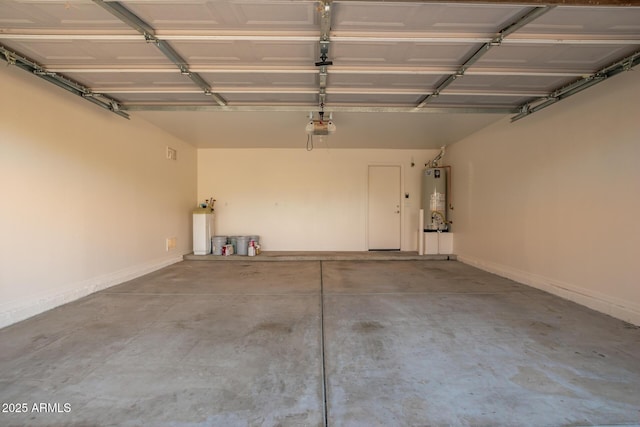 garage featuring gas water heater and a garage door opener