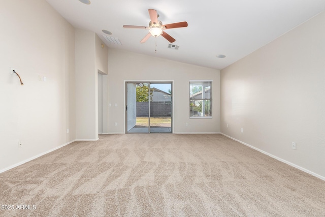 carpeted empty room with ceiling fan and vaulted ceiling