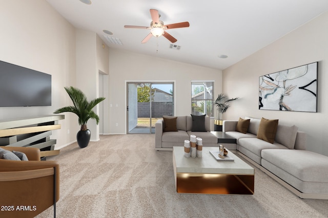 carpeted living room featuring vaulted ceiling and ceiling fan