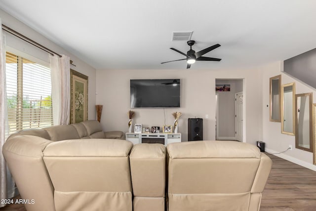 living room with ceiling fan and hardwood / wood-style flooring