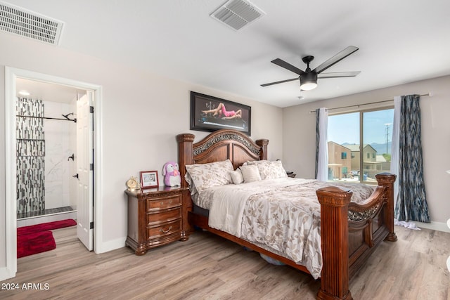 bedroom featuring access to exterior, ensuite bathroom, ceiling fan, and light wood-type flooring