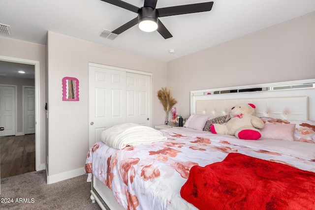 carpeted bedroom featuring a closet and ceiling fan