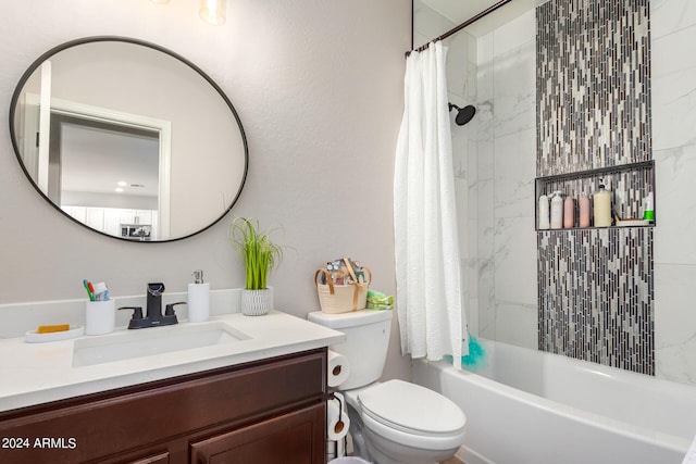 full bathroom featuring shower / bath combo, toilet, and vanity