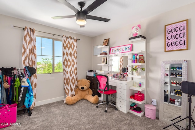 carpeted home office with ceiling fan