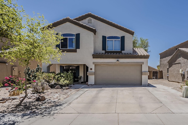2125 W Central Ave, Coolidge, AZ 85128 - mediterranean / spanish-style home with concrete driveway, stucco siding, a garage, and a tiled roof
