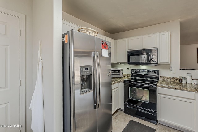 2125 W Central Ave, Coolidge, AZ 85128 - kitchen with black appliances, white cabinets, light tile patterned floors, and dark stone countertops