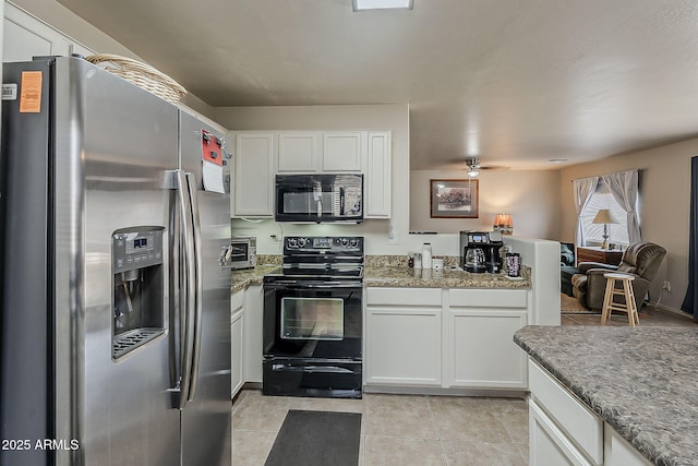 2125 W Central Ave, Coolidge, AZ 85128 - kitchen featuring black appliances, open floor plan, white cabinets, and light tile patterned flooring