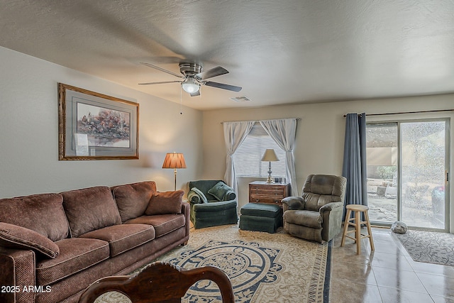 2125 W Central Ave, Coolidge, AZ 85128 - living room featuring ceiling fan, healthy amount of natural light, and light tile patterned floors