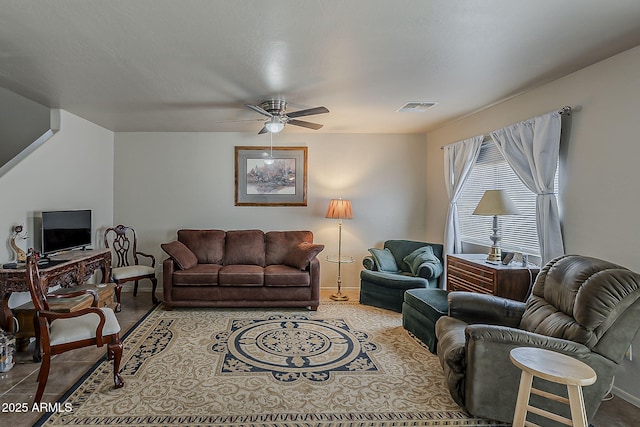 2125 W Central Ave, Coolidge, AZ 85128 - living area featuring ceiling fan and baseboards