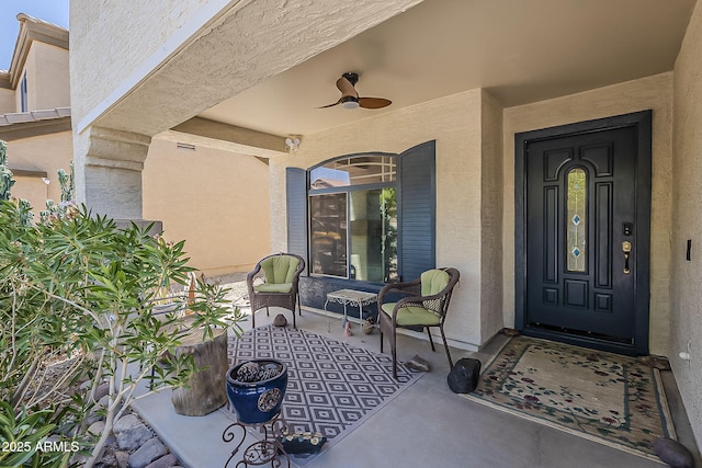 2125 W Central Ave, Coolidge, AZ 85128 - view of exterior entry featuring stucco siding, a ceiling fan, and covered porch