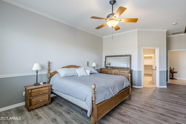 bedroom with ornamental molding, hardwood / wood-style floors, and ceiling fan