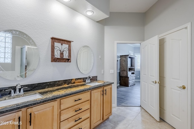 bathroom with vanity and tile patterned floors