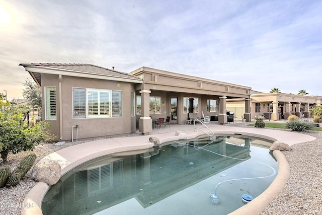 view of swimming pool featuring a patio