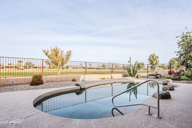 view of pool featuring a patio area