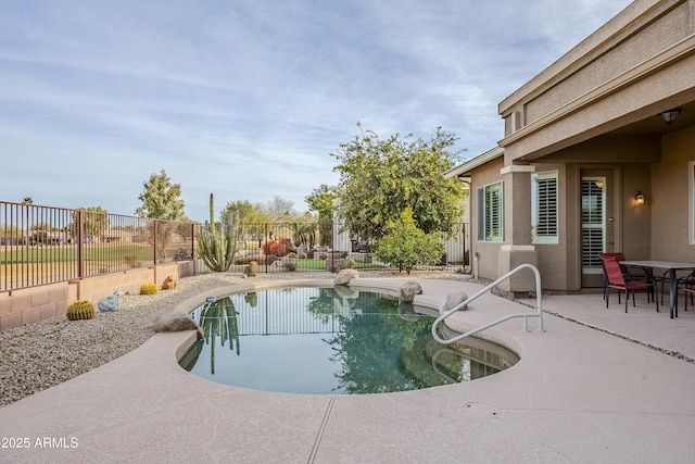 view of swimming pool featuring a patio area