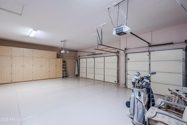 garage featuring a garage door opener