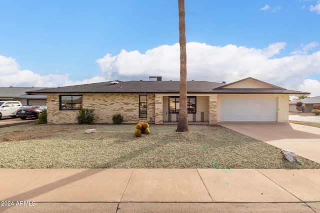 ranch-style house featuring a garage