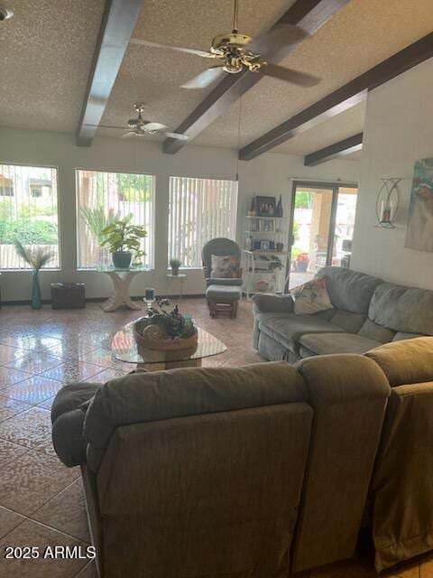 living room with a textured ceiling and a ceiling fan