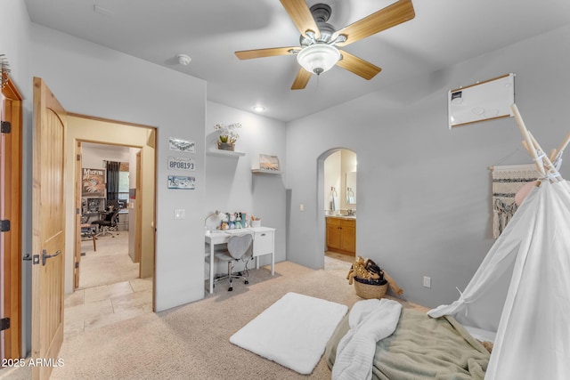 bedroom featuring ceiling fan and light colored carpet