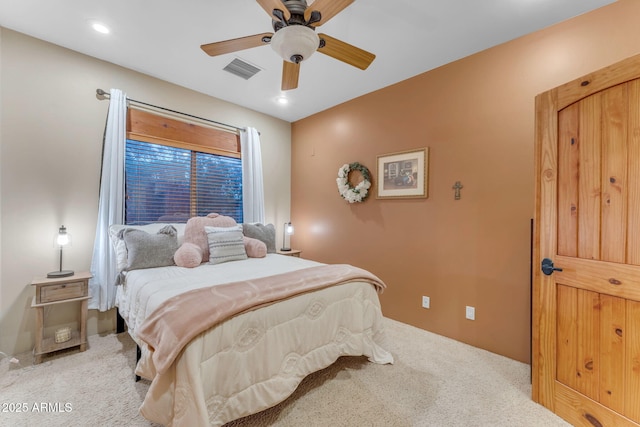 bedroom featuring ceiling fan and light colored carpet