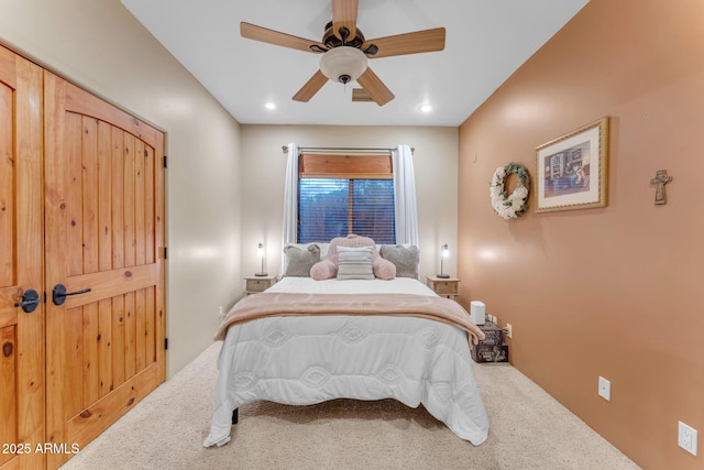 carpeted bedroom featuring ceiling fan