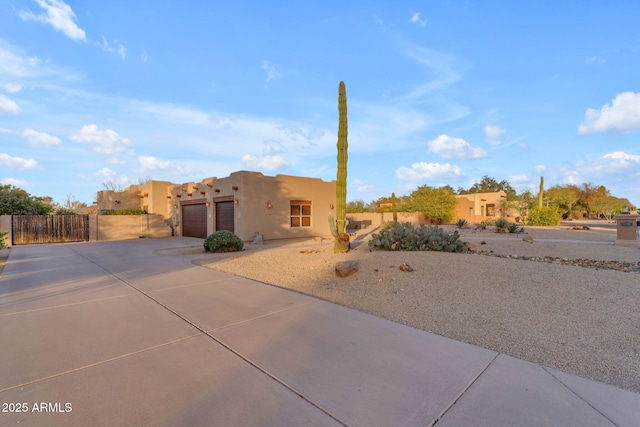 southwest-style home with a garage