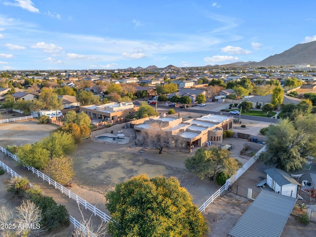 birds eye view of property with a mountain view