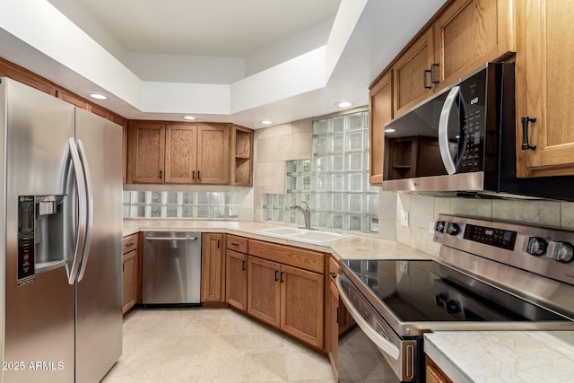902 W Glendale Ave Unit 102, Phoenix, AZ 85021 - kitchen featuring stainless steel appliances, open shelves, brown cabinetry, decorative backsplash, and recessed lighting